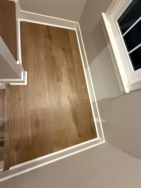 Wood-look flooring on a stair landing