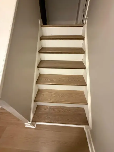 Staircase with new wood-look treads and white risers